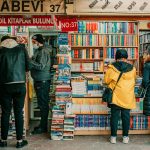 group of people choosing books
