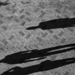 two people standing on concrete floor
